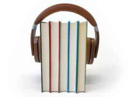 Symbolfoto: 5 aufgestellte Bücher zwischen große Kopfhörer